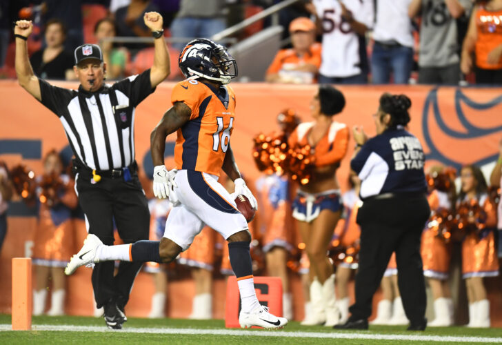 Denver Broncos wide receiver Isaiah McKenzie (16) returns a 78 yard punt return for a touchdown in the second against the Minnesota Vikings quarter at Broncos Stadium at Mile High.