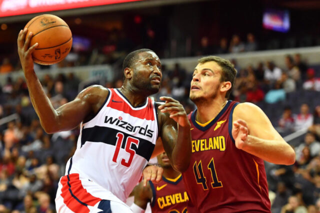 Washington Wizards guard Donald Sloan (15) drives to the basket as Cleveland Cavaliers forward Ante Zizic (41) defends during the second half at Capital One Arena.