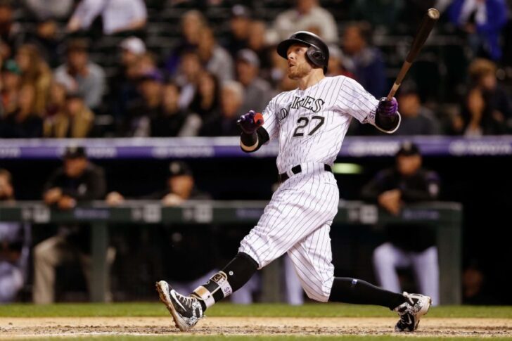 Colorado Rockies shortstop Trevor Story (27) watches his ball on a solo home run in the fourth inning against the San Francisco Giants at Coors Field.