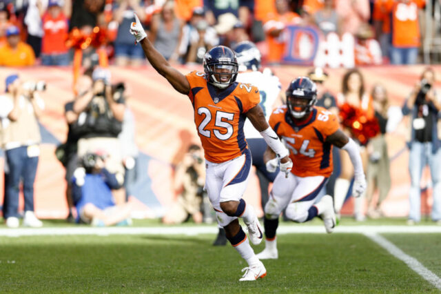 Denver Broncos cornerback Chris Harris Jr. (25) celebrates after a play in the fourth quarter against the Seattle Seahawks at Broncos Stadium at Mile High.