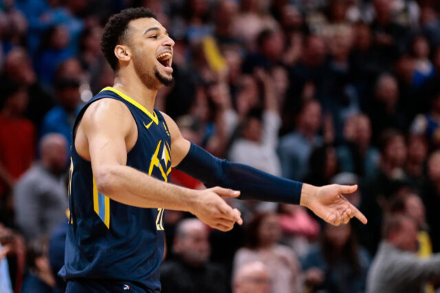 Denver Nuggets guard Jamal Murray (27) celebrates in the fourth quarter against the Golden State Warriors at the Pepsi Center.
