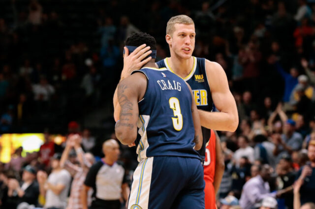 Denver Nuggets center Mason Plumlee (24) celebrates with guard Torrey Craig (3) after the game against the New Orleans Pelicans at the Pepsi Center.