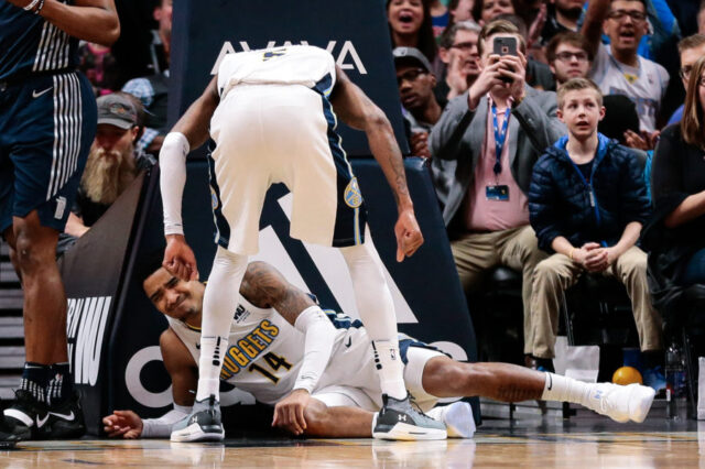 Denver Nuggets guard Gary Harris (14) reacts on the floor after a play in the fourth quarter against the Detroit Pistons at the Pepsi Center.