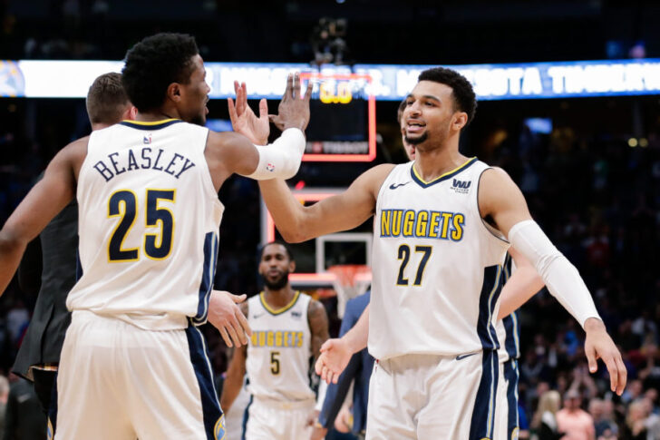 Denver Nuggets guard Jamal Murray (27) reacts with guard Malik Beasley (25) in the fourth quarter against the Milwaukee Bucks at the Pepsi Center.