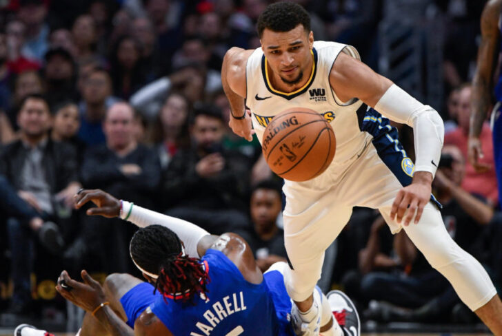 LA Clippers forward Montrezl Harrell (5) and Denver Nuggets guard Jamal Murray (27) chase down a loose ball during the second half at Staples Center