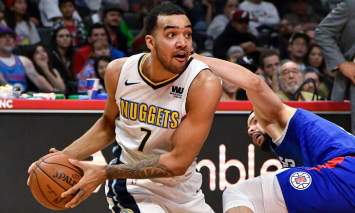 Denver Nuggets forward Trey Lyles (7) and LA Clippers guard Austin Rivers (right) go to the floor for a loose ball during the fourth quarter at Staples Center. The Nuggets went on to a 134-115 win