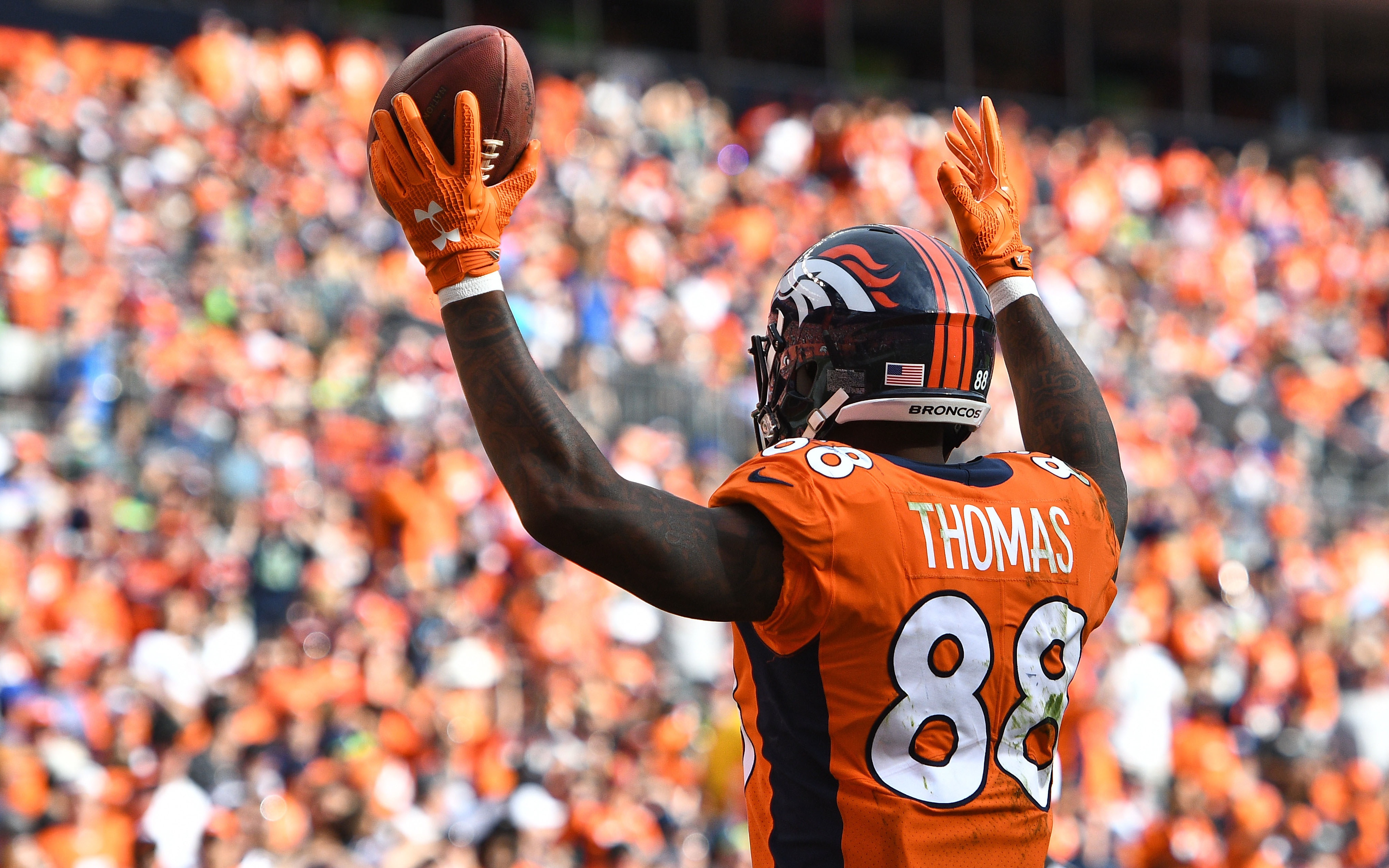 Denver Broncos orange-blue stripe uniform combo returns vs Titans