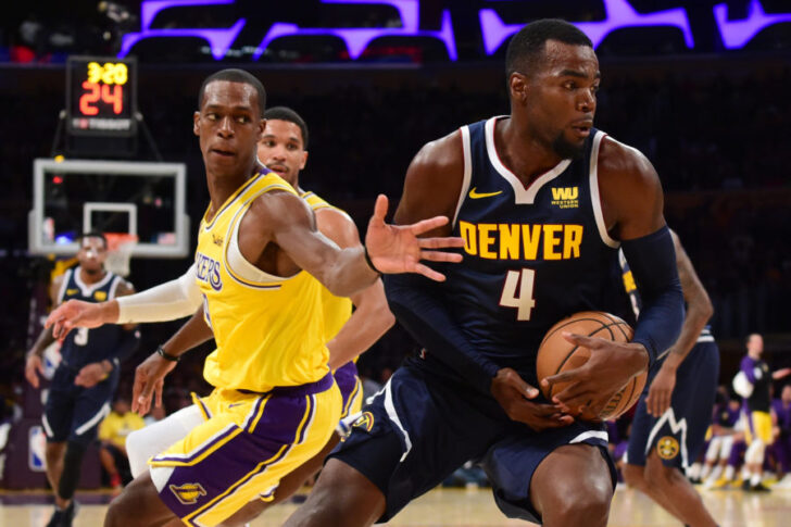 Denver Nuggets forward Paul Millsap (4) dribbles the ball past Los Angeles Lakers guard Rajon Rondo (9) in the first half at Staples Center.
