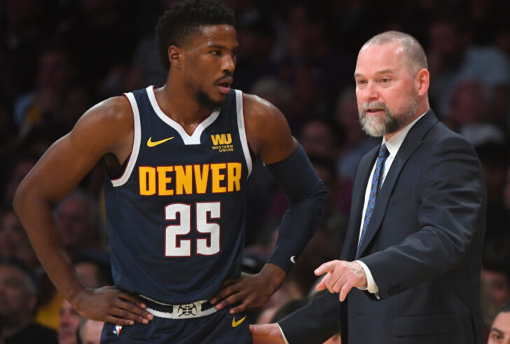 Denver Nuggets guard Malik Beasley (25) talks with head coach Michael Malone (right) in the first half of the game against the Los Angeles Lakers at Staples Center.