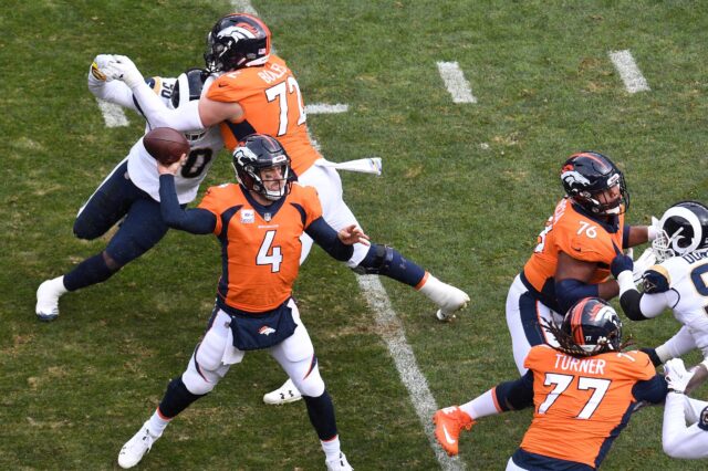 Case Keenum and the MASH unit on the offensive line. Credit: Ron Chenoy, USA TODAY Sports.