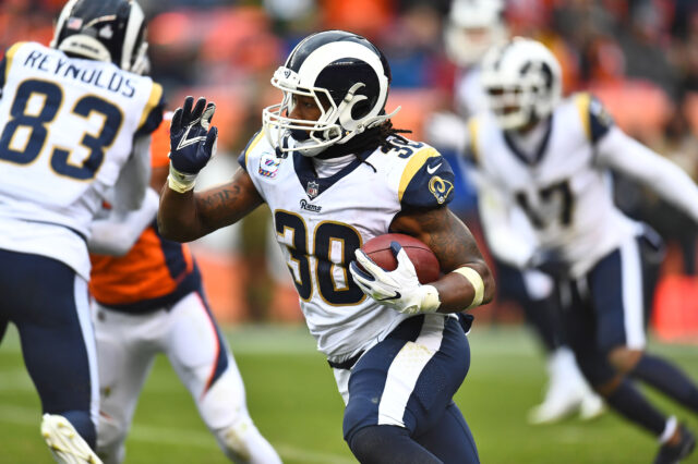 Los Angeles Rams running back Todd Gurley II (30) carries the ball in the fourth quarter against the Denver Broncos at Broncos Stadium at Mile High.