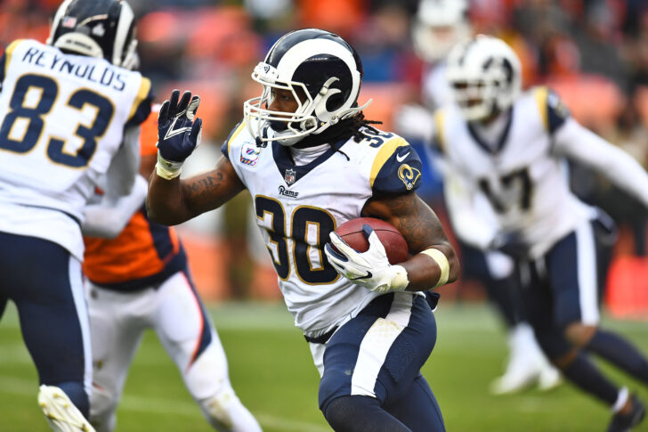 Los Angeles Rams running back Todd Gurley II (30) carries the ball in the fourth quarter against the Denver Broncos at Broncos Stadium at Mile High.