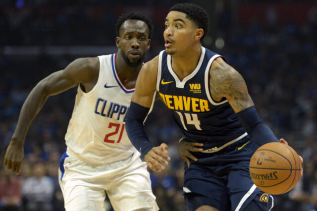 Denver Nuggets guard Gary Harris (14) dribbles against LA Clippers guard Patrick Beverley (21) during the second quarter at Staples Center.