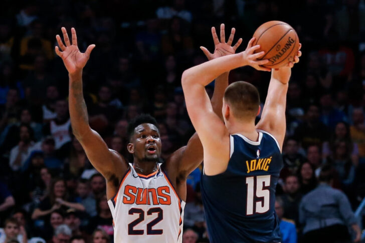 Phoenix Suns center Deandre Ayton (22) defends against Denver Nuggets center Nikola Jokic (15) in the fourth quarter at the Pepsi Center.