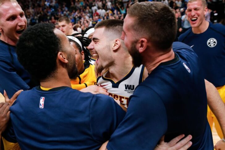 Denver Nuggets forward Juancho Hernangomez (41) celebrates with teammates after the game against the Golden State Warriors at the Pepsi Center.