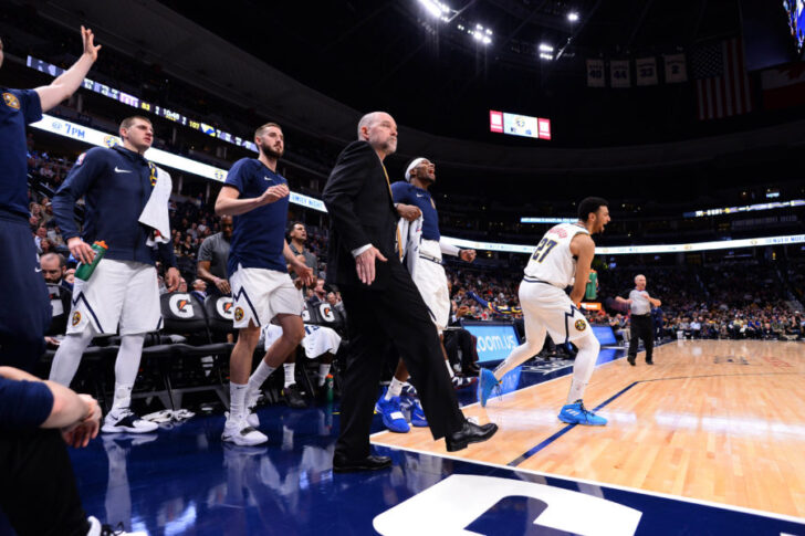 Denver Nuggets head coach Michael Malone (center) and players react to a defensive play in the fourth quarter against the Sacramento Kings at Pepsi Center.