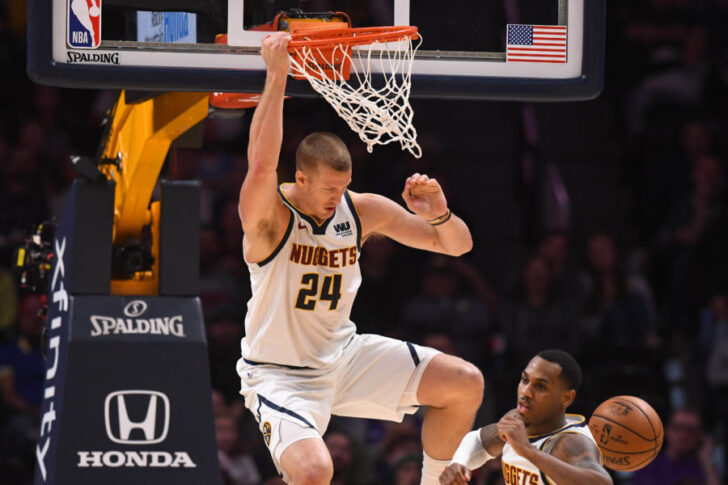 Denver Nuggets forward Mason Plumlee (24) finishes off a dunk in the second half against the Sacramento Kings at the Pepsi Center.