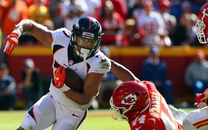 Phillip Lindsay runs out of a tackle. Credit: Jay Biggerstaff, USA TODAY Sports.
