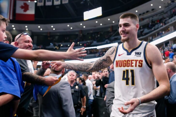 Denver Nuggets forward Juancho Hernangomez (41) greets fans after the game against the Golden State Warriors at the Pepsi Center.
