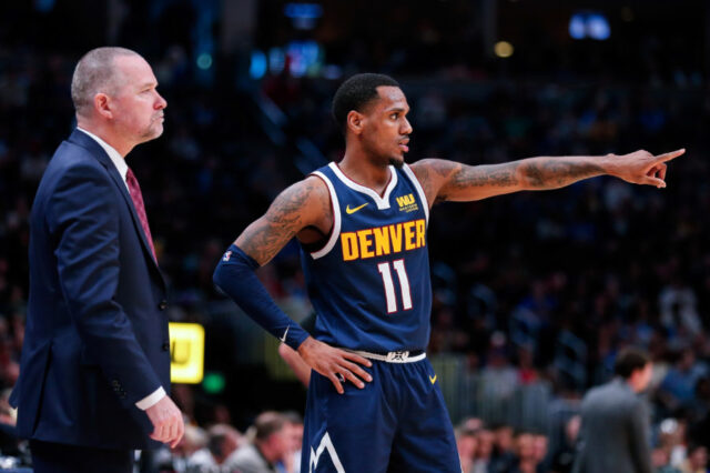 Denver Nuggets guard Monte Morris (11) talks with head coach Michael Malone in the third quarter against the New Orleans Pelicans at the Pepsi Center.