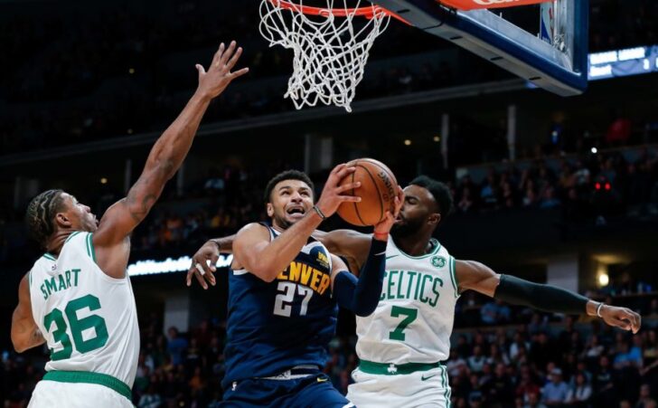 Boston Celtics guard Marcus Smart (36) and guard Jaylen Brown (7) defend against Denver Nuggets guard Jamal Murray (27) in the fourth quarter at Pepsi Center.