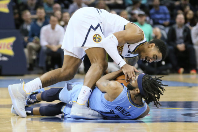 Nov 7, 2018; Memphis, TN, USA; Memphis Grizzlies guard Mike Conley (11) battles for the ball with Denver Nuggets guard Gary Harris (14) at FedExForum. Mandatory Credit: Nelson Chenault-USA TODAY Sports