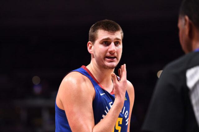 Denver Nuggets center Nikola Jokic (15) talks to a referee following his technical foul in the second quarter against the Brooklyn Nets at the Pepsi Center.