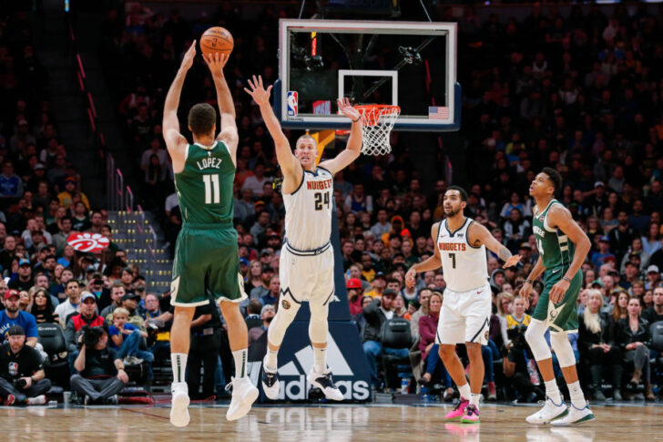 Denver Nuggets forward Mason Plumlee (24) defends on a shot from Milwaukee Bucks center Brook Lopez (11) as forward Trey Lyles (7) and forward Giannis Antetokounmpo (34) battle for position in the fourth quarter at the Pepsi Center.