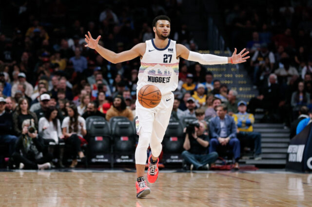 Denver Nuggets guard Jamal Murray (27) motions as he brings the ball up court in the first quarter against the Houston Rockets at the Pepsi Center