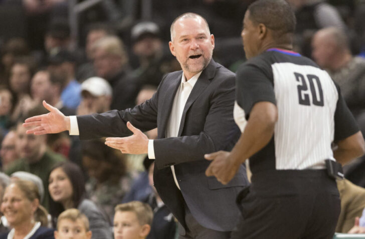 Denver Nuggets head coach Michael Malone argues a call with official Leroy Richardson (20) during the first quarter against the Milwaukee Bucks at Wisconsin Entertainment and Sports Center.