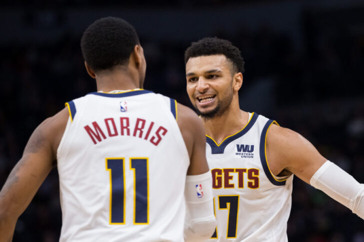 Denver Nuggets guard Jamal Murray (27) celebrates with guard Monte Morris (11) in the third quarter against Minnesota Timberwolves at Target Center.