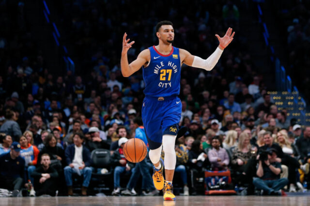 Denver Nuggets guard Jamal Murray (27) motions as he brings the ball up court in the second quarter against the Orlando Magic at the Pepsi Center.