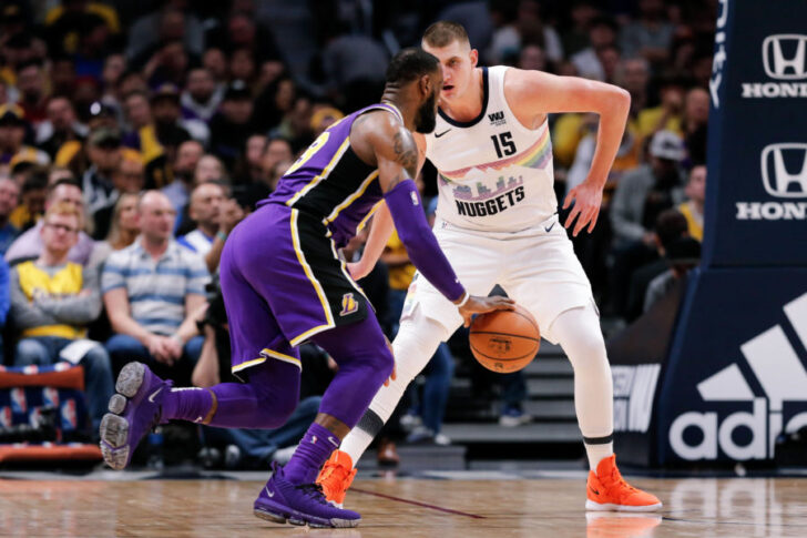 Denver Nuggets center Nikola Jokic (15) guards Los Angeles Lakers forward LeBron James (23) in the second quarter at the Pepsi Center.