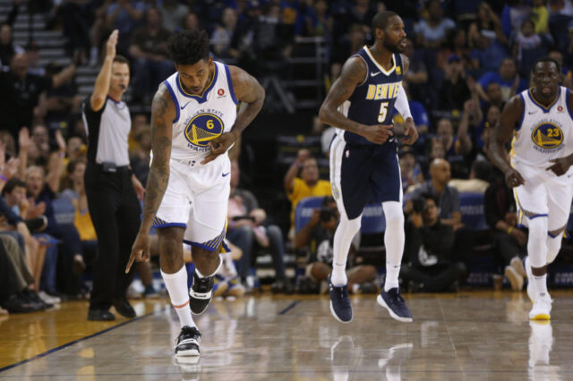 Golden State Warriors guard Nick Young (6) reacts after making a three point basket against the Denver Nuggets in the second quarter at Oracle Arena.