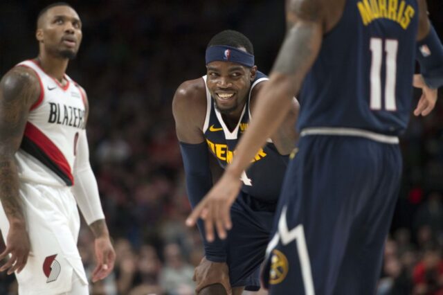 Denver Nuggets forward Paul Millsap (4) smiles after getting called for a foul during the second half against the Portland Trail Blazers at Moda Center. The Nuggets beat the Trail Blazers 113-112.