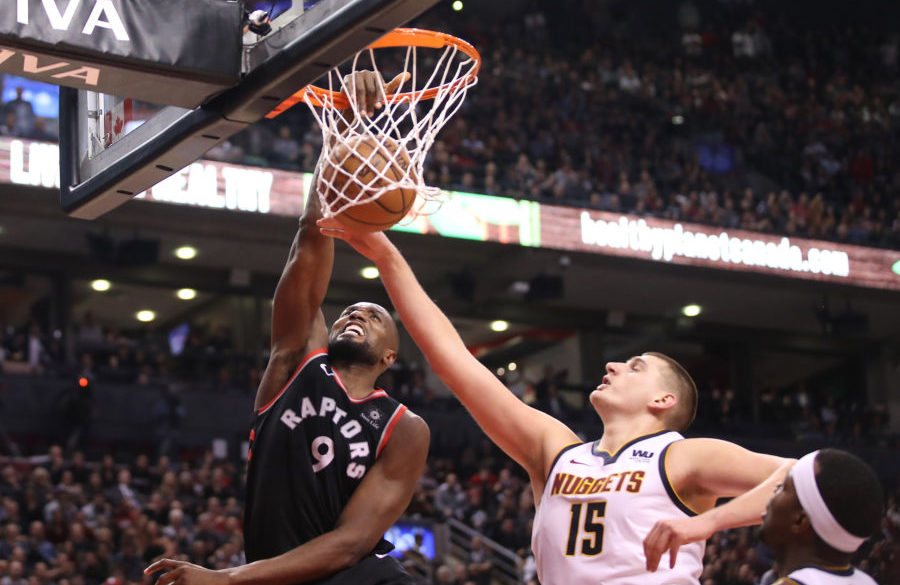 NBA: Denver Nuggets at Toronto Raptors Toronto Raptors forward Serge Ibaka (9) dunks to tie the game in the fourth quarter against Denver Nuggets center Nikola Jokic (15) at Scotiabank Arena. The Nuggets beat the Raptors 106-103.