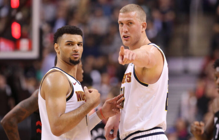 Denver Nuggets forward Mason Plumlee (24) talks to guard Jamal Murray (27) against the Toronto Raptors at Scotiabank Arena. The Nuggets beat the Raptors 106-103.