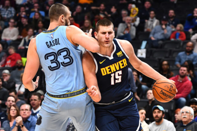 Memphis Grizzlies center Marc Gasol (33) elbows Denver Nuggets center Nikola Jokic (15) in the chin in the first quarter at the Pepsi Center.