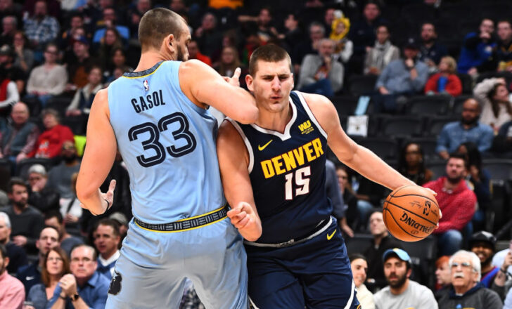 Memphis Grizzlies center Marc Gasol (33) elbows Denver Nuggets center Nikola Jokic (15) in the chin in the first quarter at the Pepsi Center.