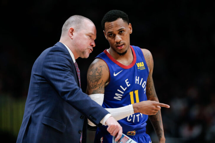 Denver Nuggets head coach Michael Malone talks with guard Monte Morris (11) in the third quarter against the Oklahoma City Thunder at the Pepsi Center.