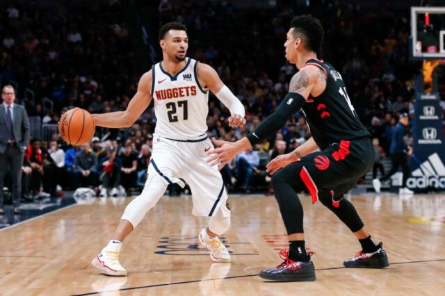 Toronto Raptors guard Danny Green (14) guards Denver Nuggets guard Jamal Murray (27) in the first quarter at the Pepsi Center.