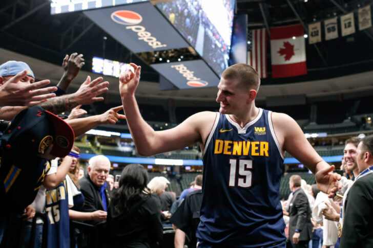 Denver Nuggets center Nikola Jokic (15) celebrates coming off the court after the game against the Dallas Mavericks at the Pepsi Center.