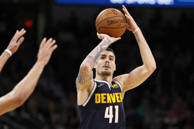 Denver Nuggets power forward Juan Hernangomez (41) shoots the ball over San Antonio Spurs point guard Derrick White (not pictured) during the second half at AT&T Center.