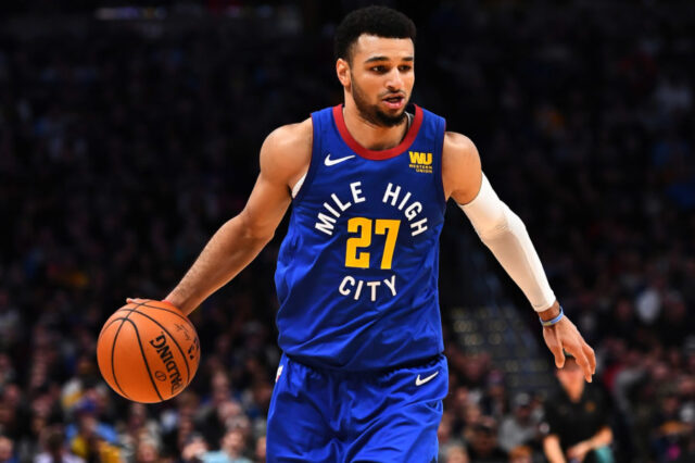 Denver Nuggets guard Jamal Murray (27) controls the ball during the second half against the San Antonio Spurs at the Pepsi Center.