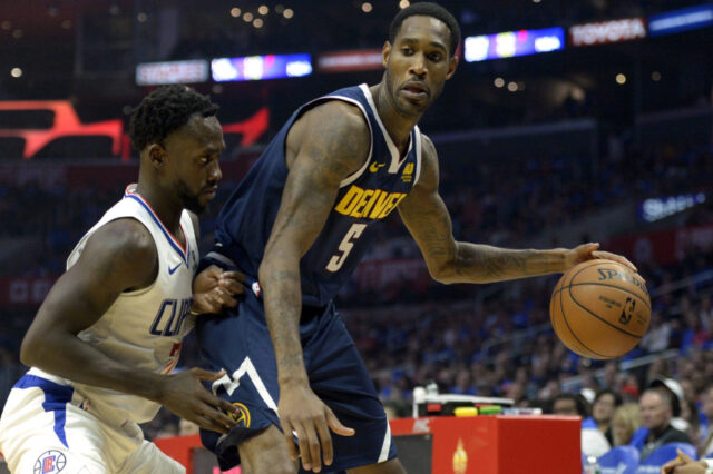 Denver Nuggets guard Will Barton (5) dribbles against Clippers guard Patrick Beverley (21) during the second quarter at Staples Center.