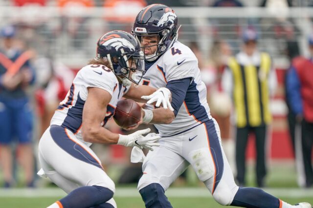 Case Keenum and Phillip Lindsay. Credit: Stan Szeto, USA TODAY Sports.