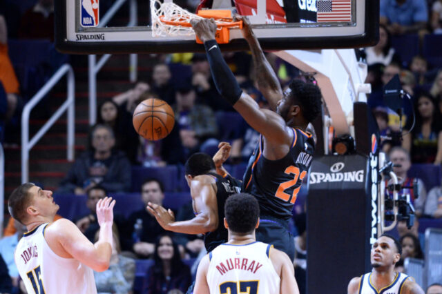 Phoenix Suns center Deandre Ayton (22) dunks against the Denver Nuggets during the second half at Talking Stick Resort Arena.