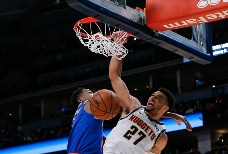 Denver Nuggets guard Jamal Murray (27) dunks the ball against New York Knicks guard Frank Ntilikina (11) in the first quarter at the Pepsi Center.