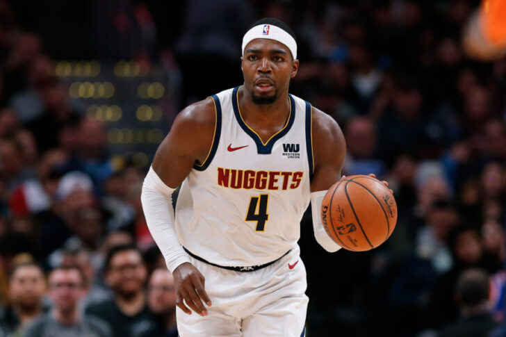 Denver Nuggets forward Paul Millsap (4) dribbles the ball up court in the second quarter against the New York Knicks at the Pepsi Center.