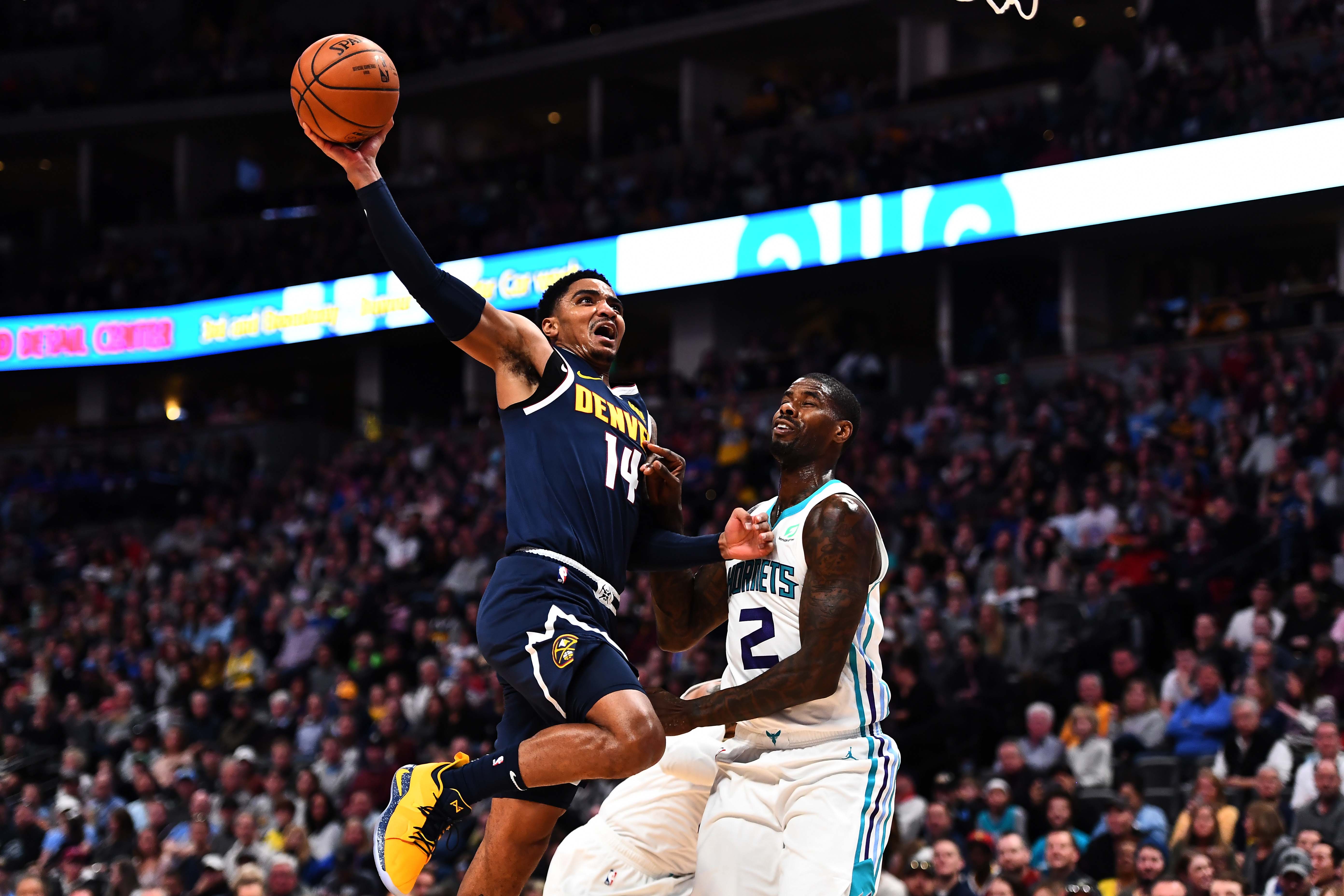 NBA: Charlotte Hornets at Denver Nuggets Denver Nuggets guard Gary Harris (14) attempts a shot over Charlotte Hornets forward Marvin Williams (2) in the second quarter at the Pepsi Center.